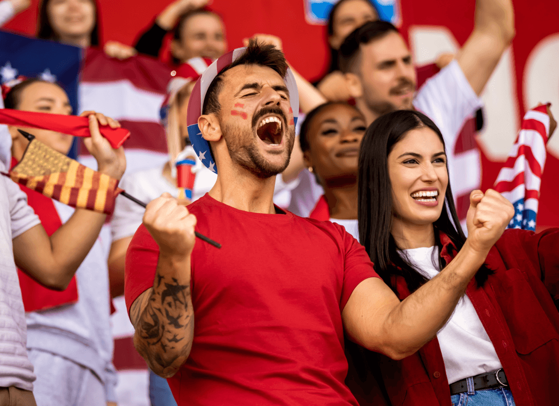 A fan cheering at a soccer event.
