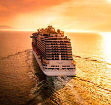 A cruise ship sailing at dawn