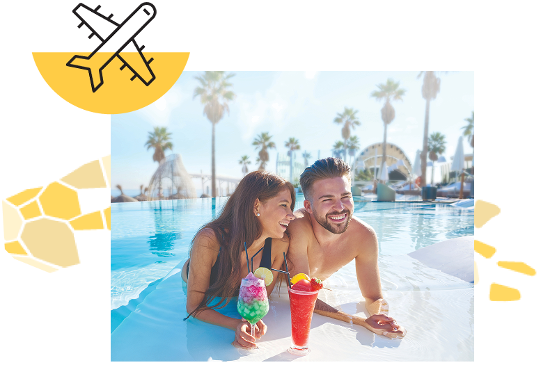 A smiling man and woman lounging in a crystal-clear pool with tropical drinks on a bright afternoon.  