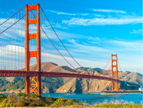 View of the expansive and iconic Golden Gate Bridge in California on a bright afternoon.
