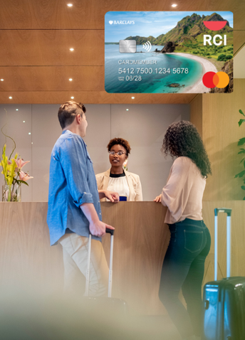 A couple checking into a hotel with a Barclays RCI credit card on top.