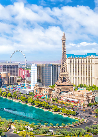 An aerial view of the Las Vegas strip featuring the Eiffel tower and High Roller.