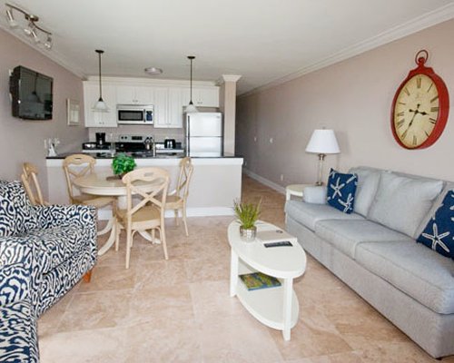 Living room with double pull out sofa and television.