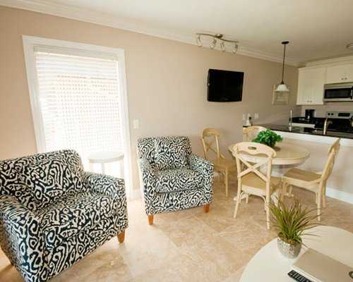 An open plan living room with kitchen and dining.
