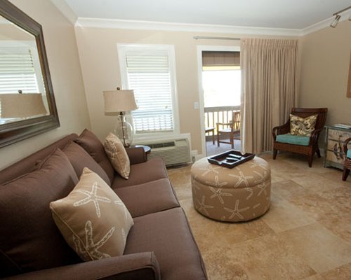 Furnished living room with a balcony.