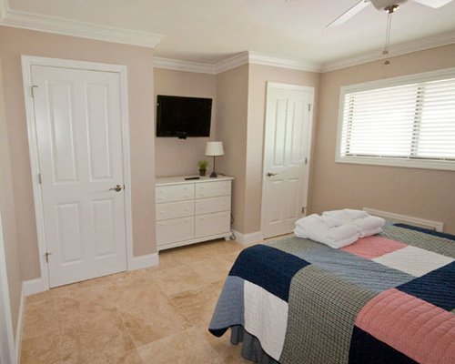 Bedroom with a double bed and a television.