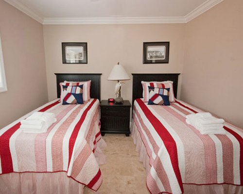 A bedroom with two beds.