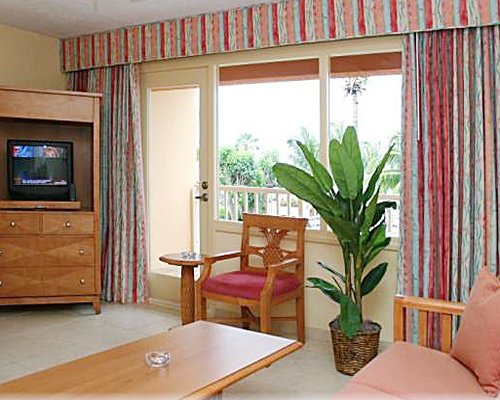 Furnished living room with a balcony.