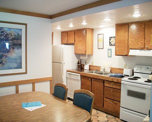 A well equipped kitchen with dining area.