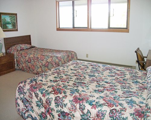 Furnished bedroom with two beds.