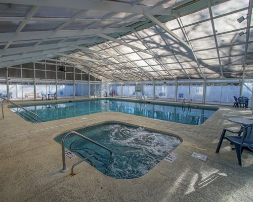An indoor swimming pool and hot tub.