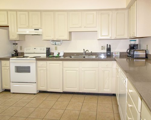 An open plan living and dining area with a television.