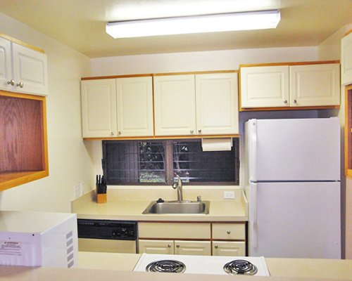 Kitchen with stove and refrigerator.