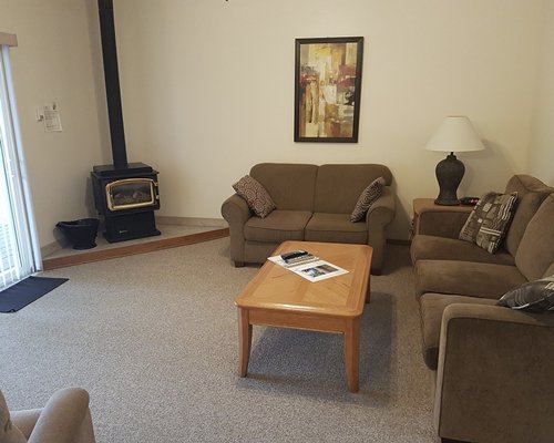 Furnished living room with a television and fireplace.