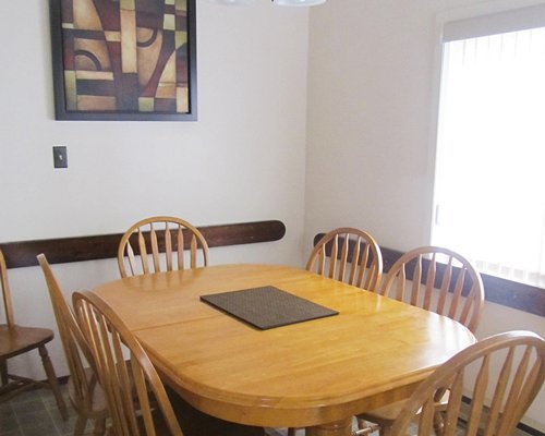A well furnished dining area with outdoor view.