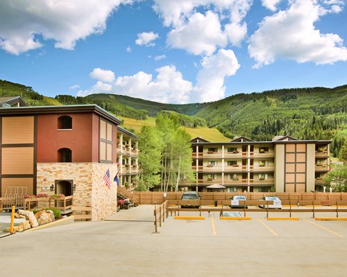 Exterior view of The Wren resort with car parking.