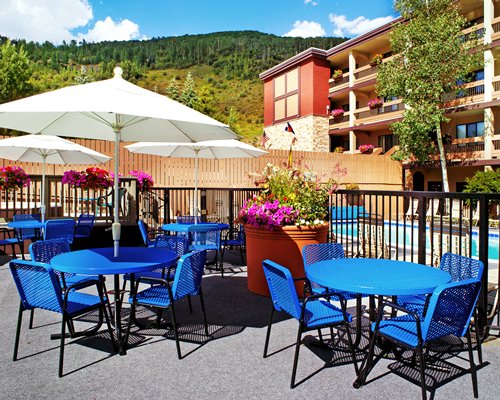 A view of patio furniture with umbrella.