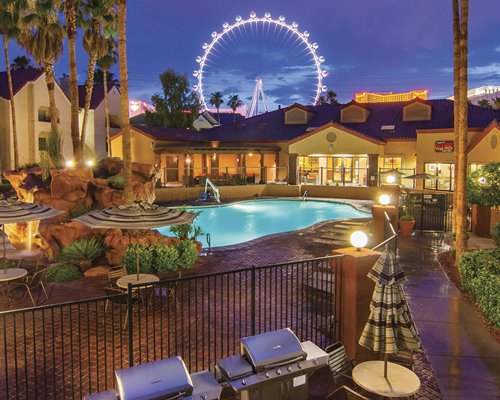 A resort at night with pool.