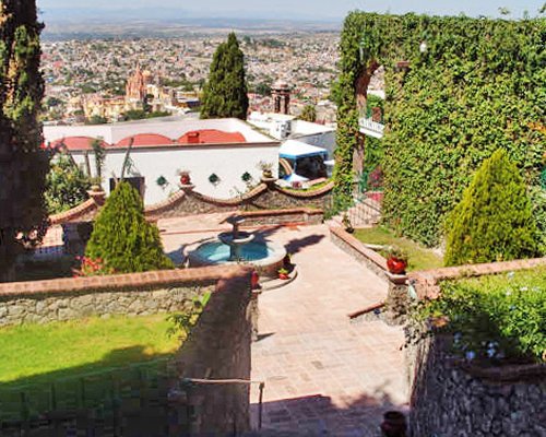 A scenic distant view of the Condo Hotel Posada La Ermita resort.