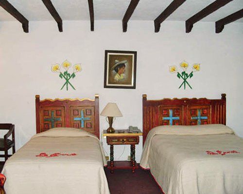 A well furnished bedroom with a twin bed and a full bed.
