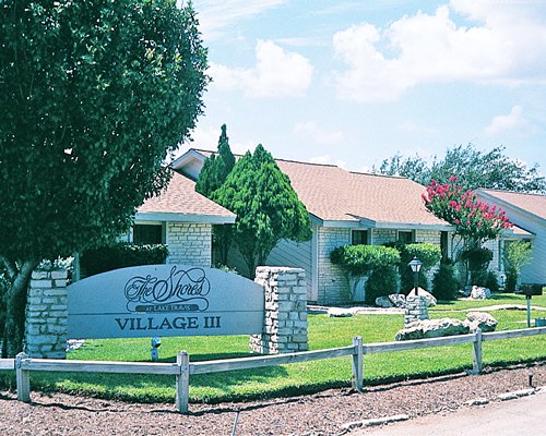Signboard of The Shores at Lake Travis Village III resort.