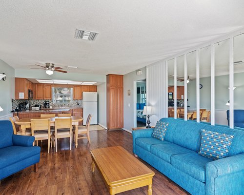 Living room with open plan dining area and outdoor view.