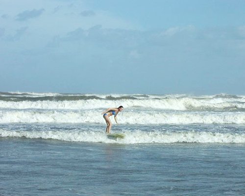 A woman surfing in the ocean.