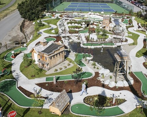 An aerial view of mini golf course alongside tennis court.