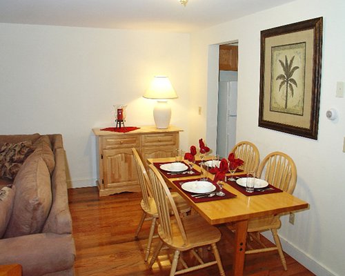 An open plan furnished living room with dining area.