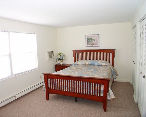 A well furnished bedroom with a queen bed.