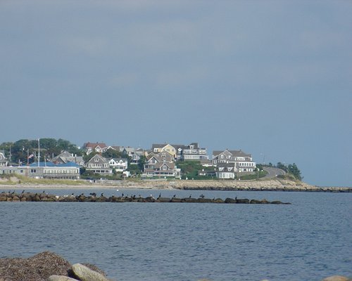 View of buildings alongside ocean.
