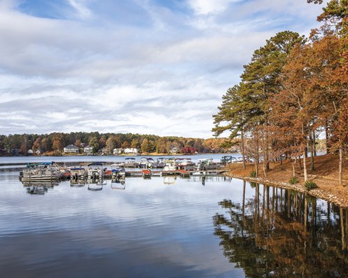 A lake view of the Fairfield Plantation resort surrounded by wooded area.