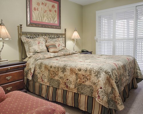 A well furnished bedroom with a king bed.