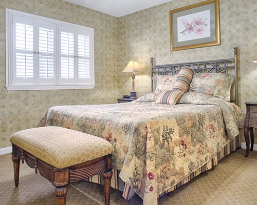 A well furnished bedroom with a king bed.