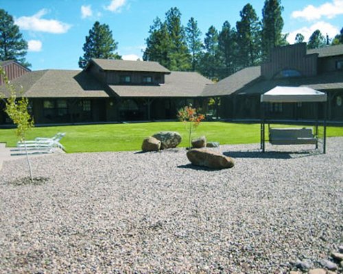 Picnic area surrounded by lawn.