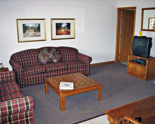 Furnished living room with television.