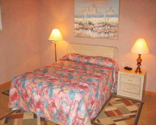 A well furnished bedroom with a double bed.