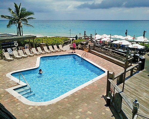 An outdoor swimming pool along the beach.