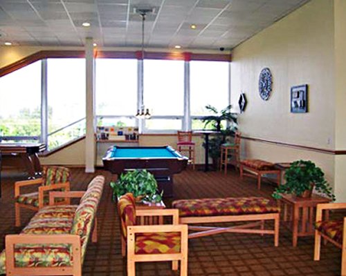 A well furnished recreation room with a pool table.