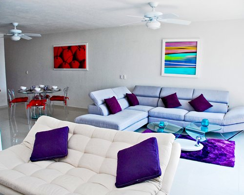 A well furnished living room and dining area.