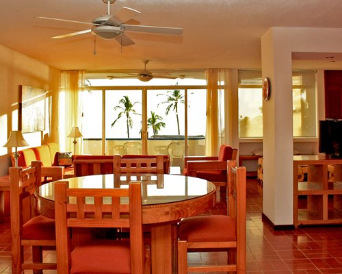An open plan living and dining area with an outside view.
