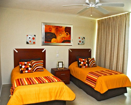 Furnished bedroom with two twin beds.