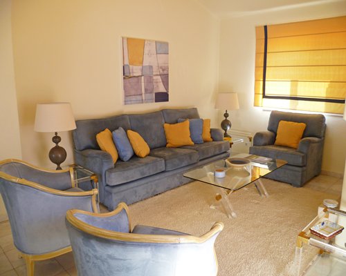 A furnished living room with pull out sofa.