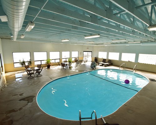 A large sized indoor swimming pool.