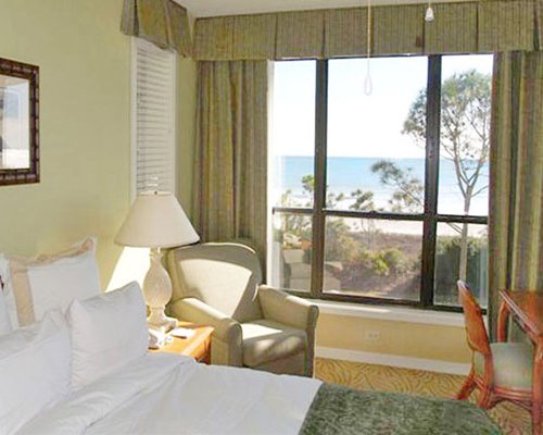 Furnished bedroom with ocean view.