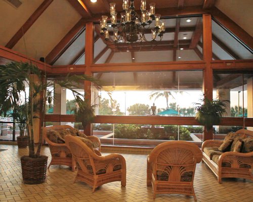 Lounge area of the Surf Club of Marco resort with an outside view.