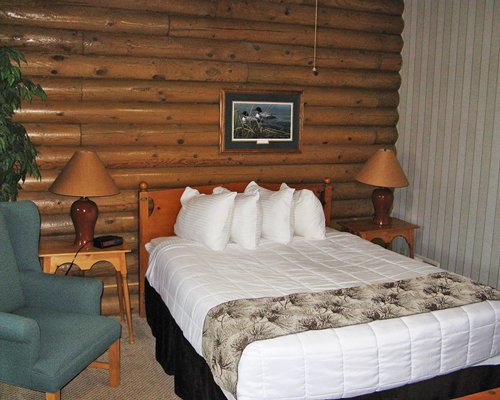 A furnished bedroom with a queen bed.