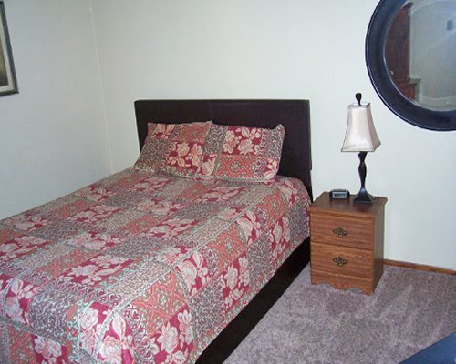 A furnished bedroom with a full bed.