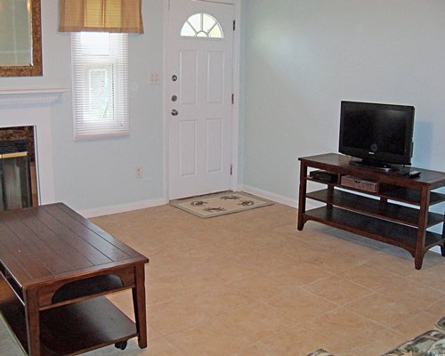 A well furnished living room with a television.