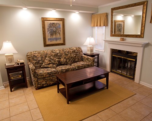 A well furnished living room with a fireplace.
